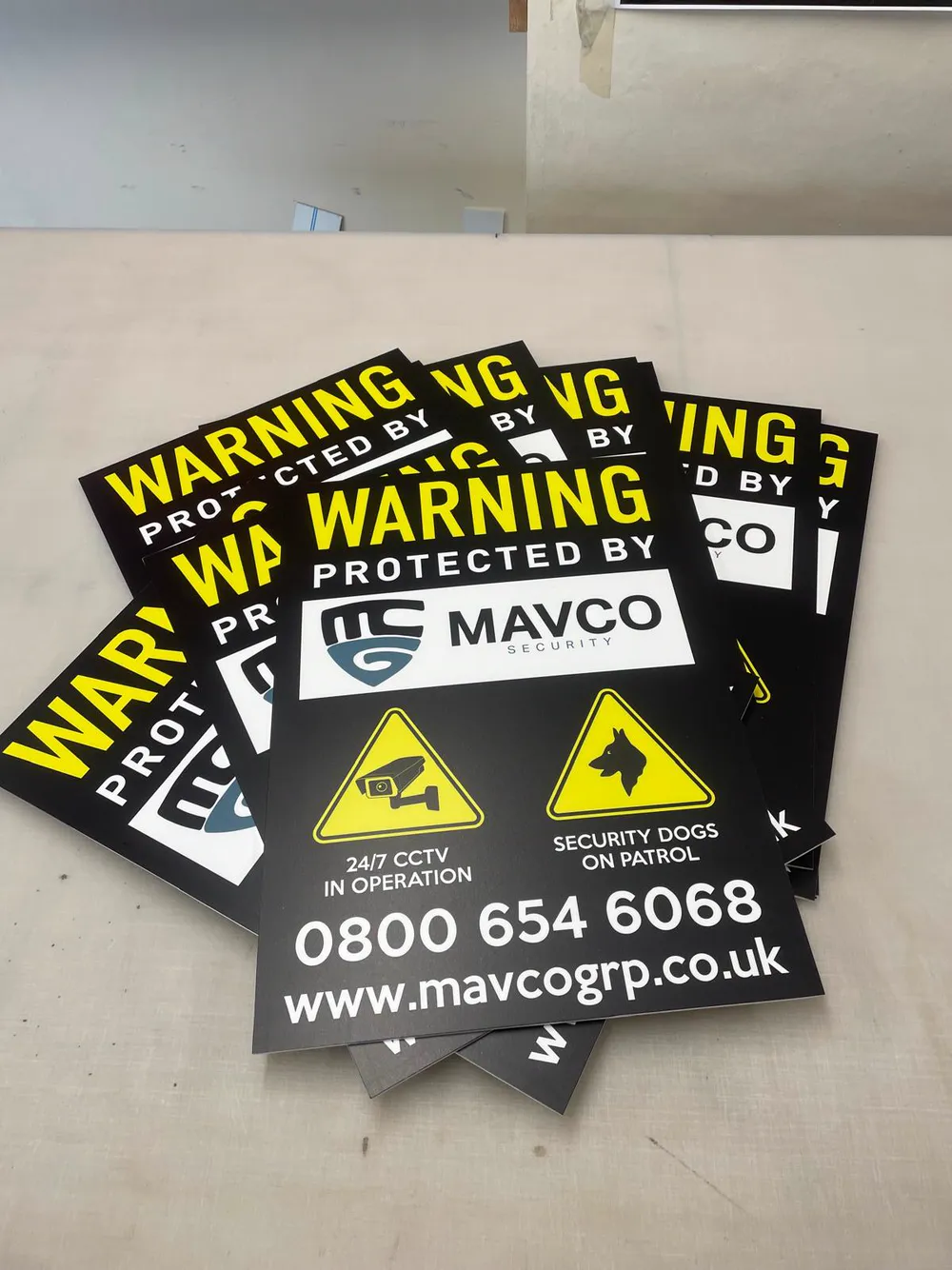 MavCo warning signs — 24/7 CCTV and security dogs on patrol