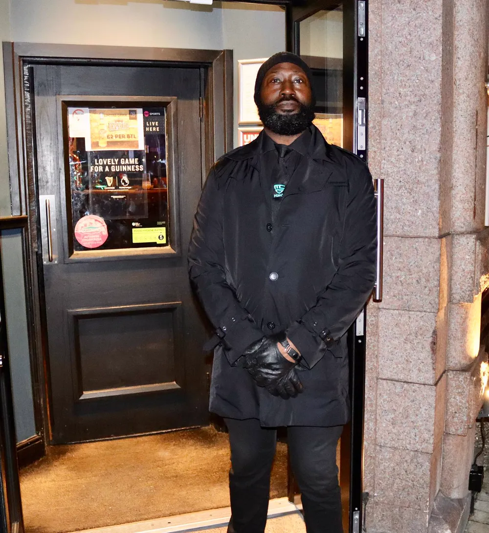 MavCo door supervisor at a pub door